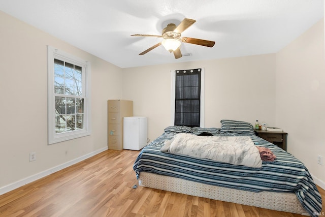 bedroom featuring light hardwood / wood-style floors and ceiling fan