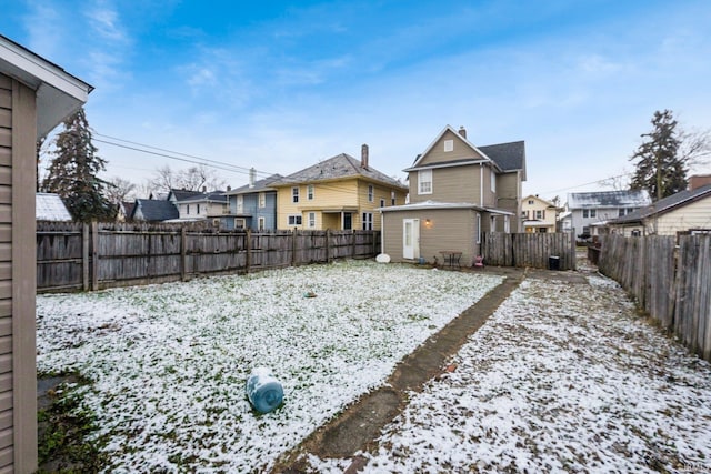 view of yard layered in snow