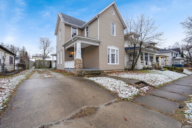 view of property exterior with covered porch