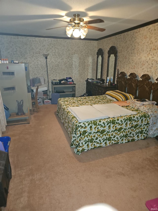 bedroom featuring carpet flooring, ceiling fan, and crown molding