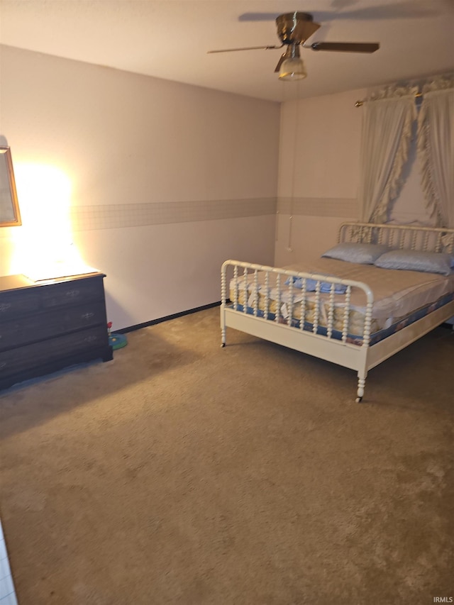 unfurnished bedroom featuring carpet and ceiling fan