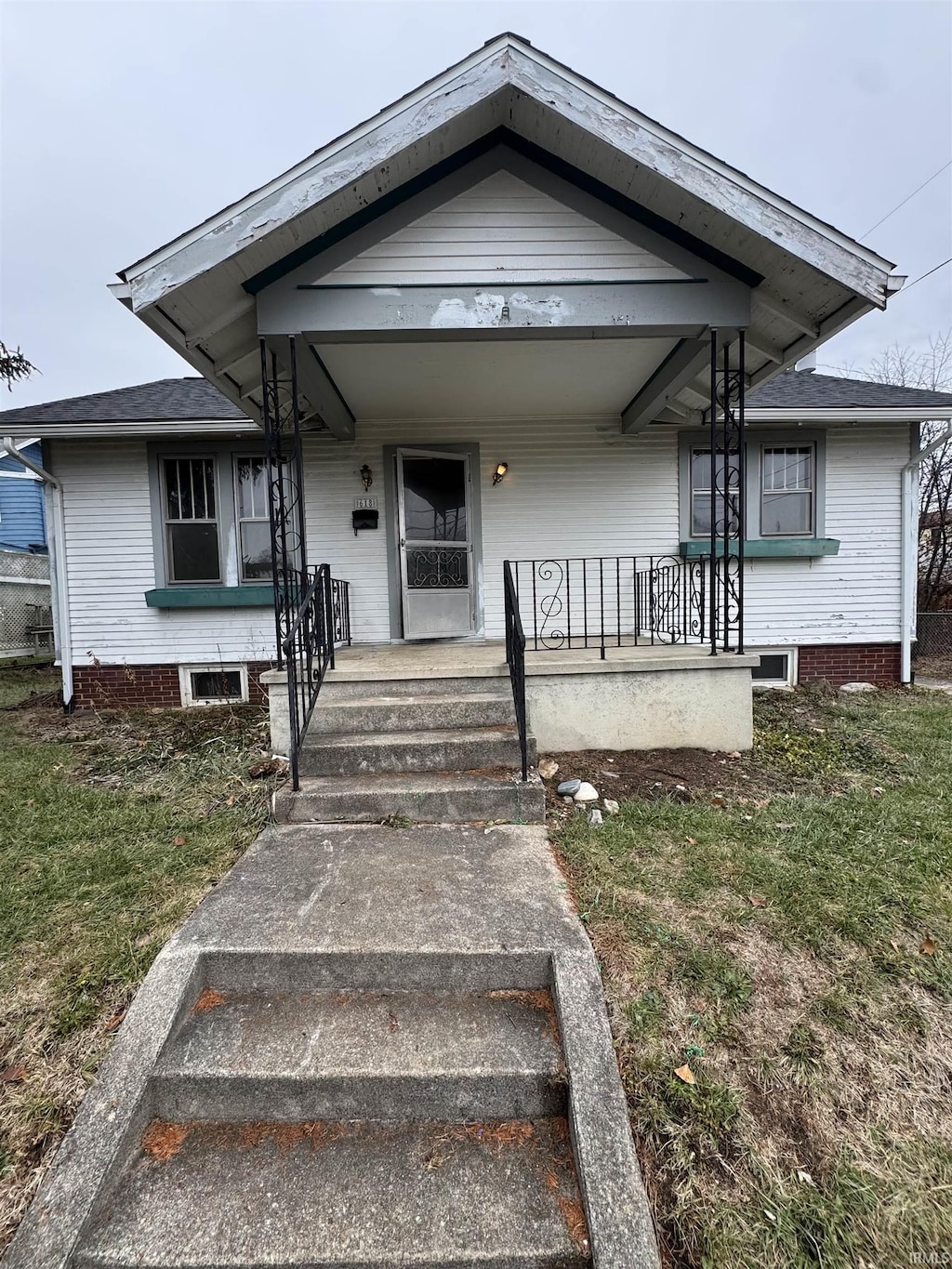 bungalow-style home with a porch