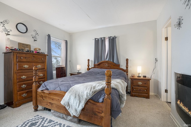 bedroom featuring light colored carpet