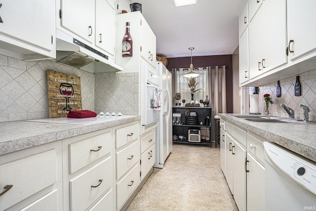 kitchen with sink, white cabinetry, decorative light fixtures, white appliances, and decorative backsplash