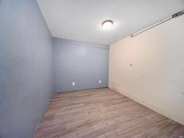 empty room with light hardwood / wood-style floors