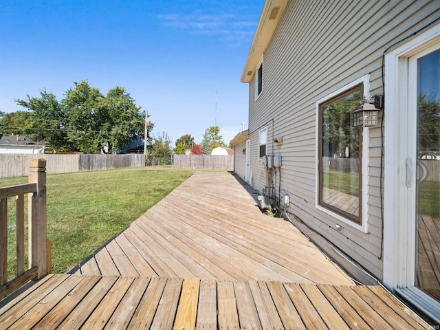 wooden deck with a lawn