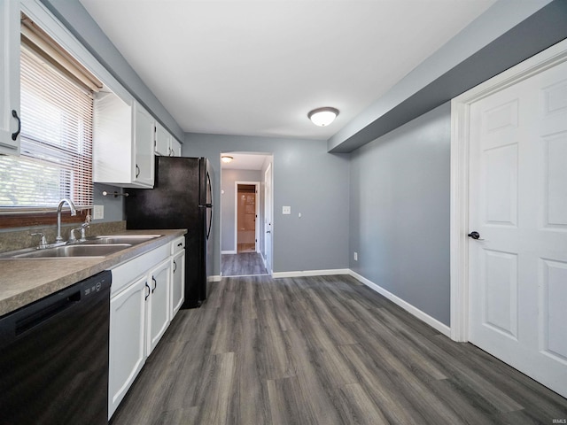 kitchen with dark wood-type flooring, sink, white cabinets, and black appliances