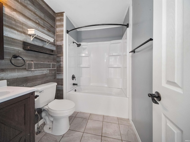 full bathroom featuring shower / bathing tub combination, wooden walls, vanity, and toilet