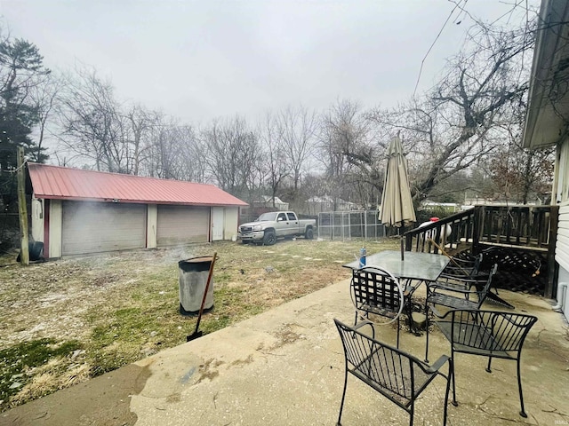 view of patio / terrace featuring an outdoor structure and a wooden deck