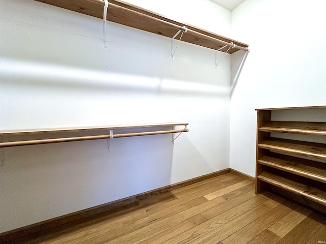 walk in closet featuring wood-type flooring