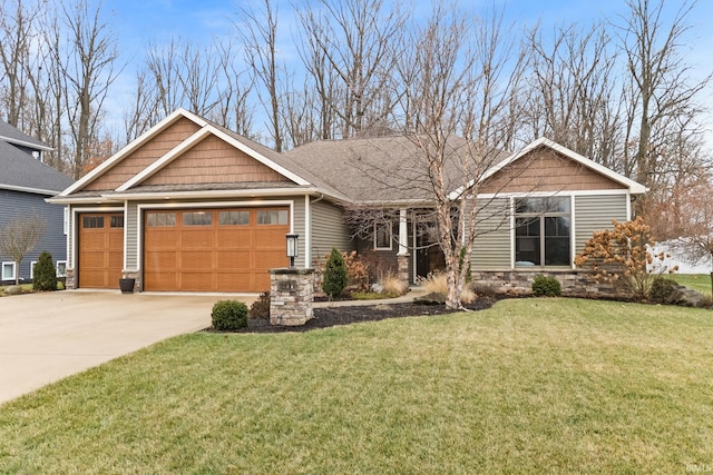 craftsman inspired home with a garage and a front lawn