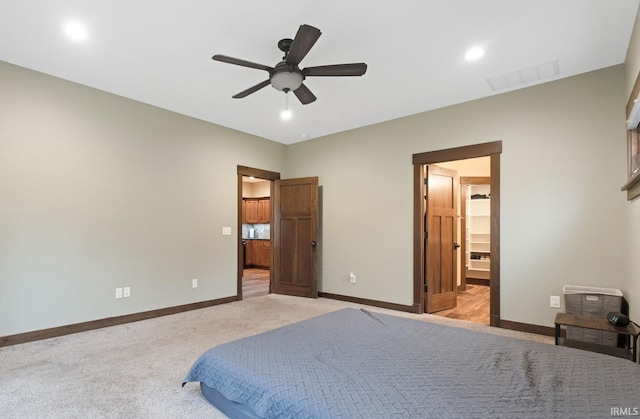 carpeted bedroom featuring ceiling fan