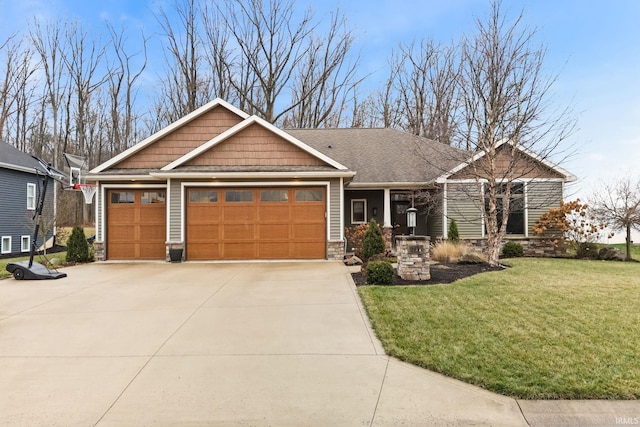 craftsman-style house featuring a front lawn and a garage