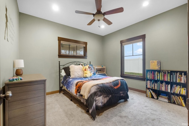 carpeted bedroom featuring ceiling fan