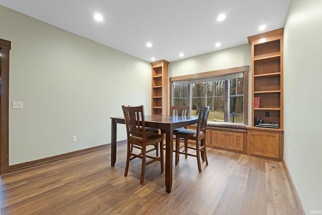 dining area with hardwood / wood-style flooring