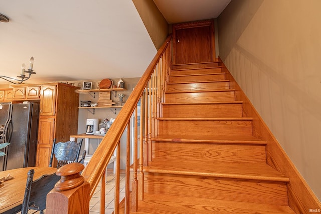 staircase with tile patterned floors