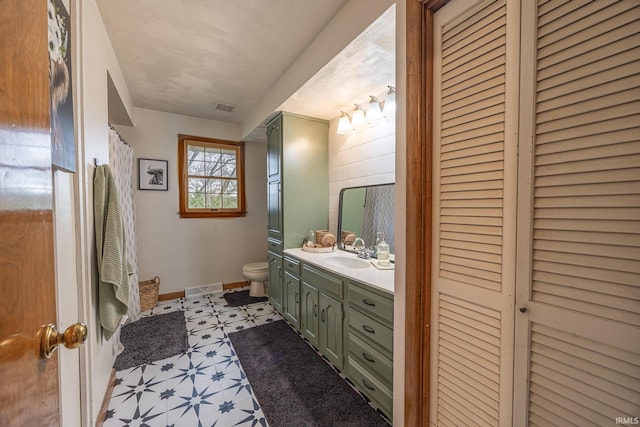 bathroom with vanity and toilet