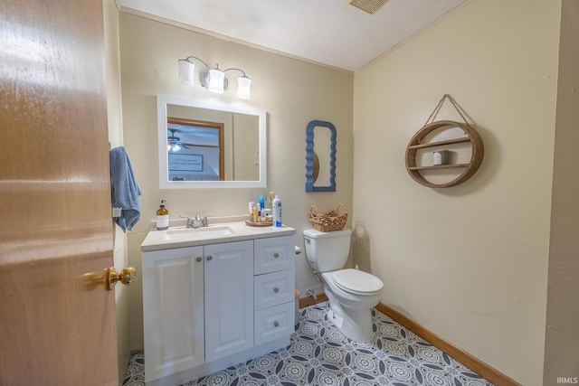 bathroom with tile patterned floors, vanity, and toilet