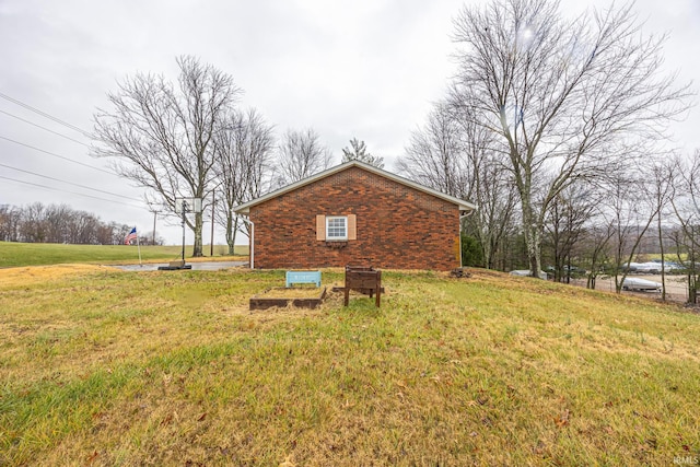 view of property exterior with a lawn