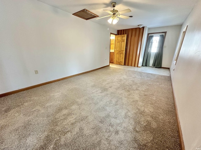 unfurnished room featuring carpet flooring and ceiling fan