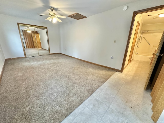 bedroom with ceiling fan, a closet, and light carpet