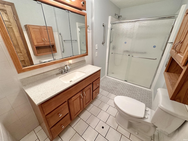 full bathroom featuring tile patterned flooring, vanity, toilet, and enclosed tub / shower combo