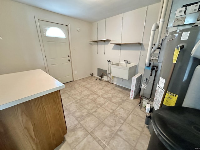 washroom with sink, cabinets, and washer hookup