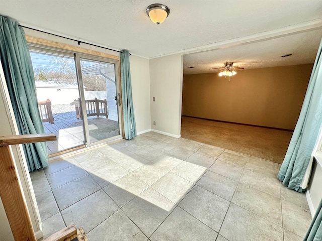 unfurnished room featuring ceiling fan and light tile patterned floors