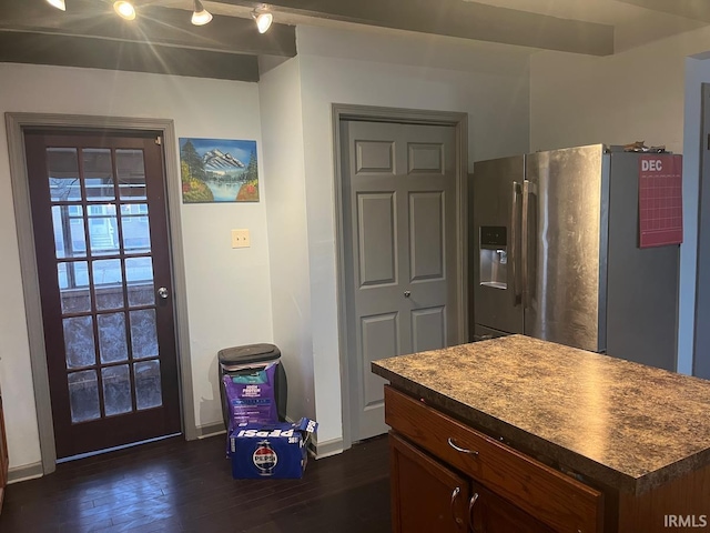 kitchen with stainless steel refrigerator with ice dispenser and dark hardwood / wood-style floors