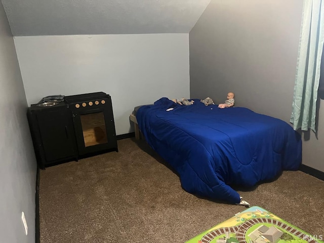 carpeted bedroom featuring vaulted ceiling