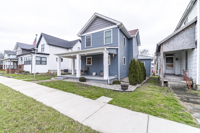 view of front of house featuring a front yard and a porch