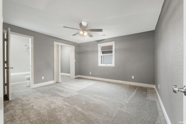 3598 W Huntington Ave 57th Ave, Columbia City, IN 46725 - unfurnished bedroom featuring carpet, baseboards, ceiling fan, and connected bathroom