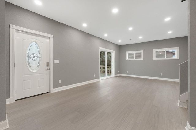 entrance foyer with light hardwood / wood-style flooring