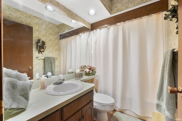 bathroom featuring vanity and toilet