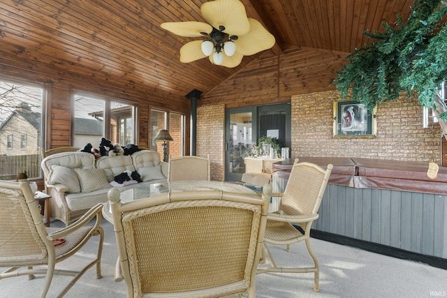 view of patio with a hot tub and ceiling fan