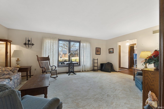 living room featuring light carpet