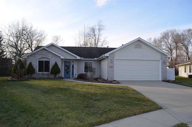 single story home featuring a garage and a front yard