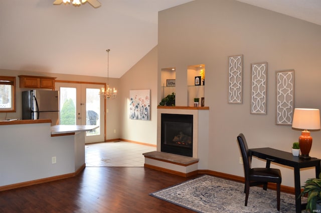 interior space with french doors, high vaulted ceiling, ceiling fan, and dark wood-type flooring