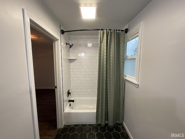 bathroom featuring tile patterned flooring and shower / tub combo