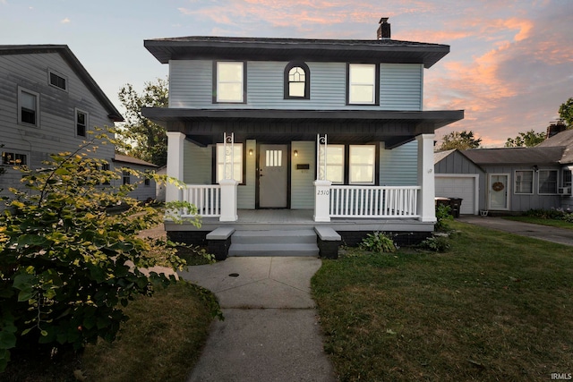 view of front of property featuring a lawn and a porch