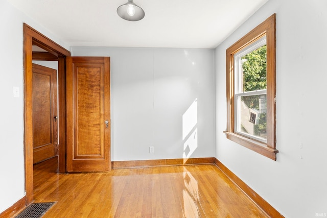 spare room featuring hardwood / wood-style flooring