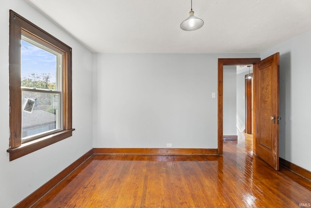 empty room featuring dark wood-type flooring