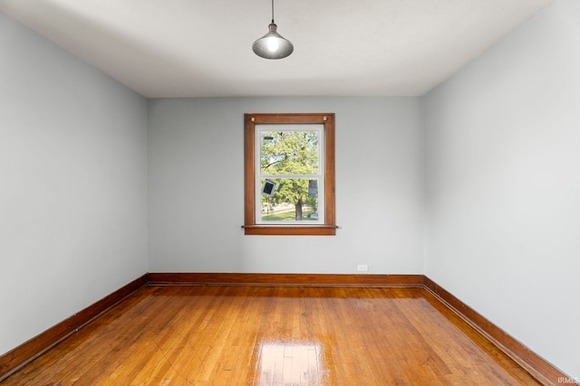 unfurnished room featuring hardwood / wood-style floors