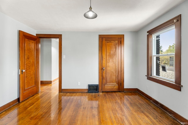 unfurnished bedroom featuring wood-type flooring