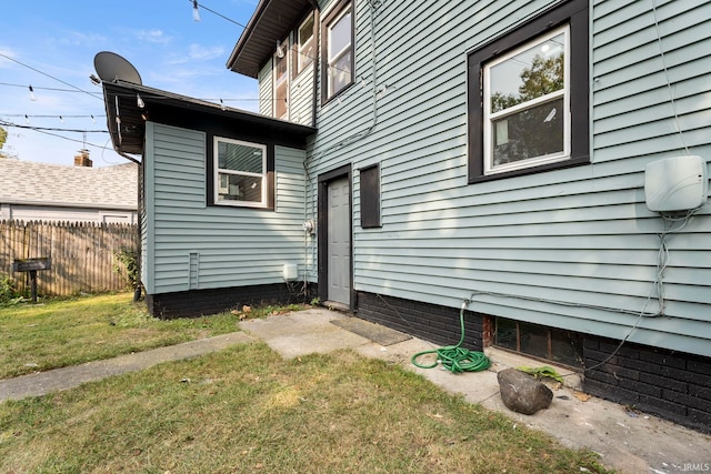 view of side of home featuring a yard