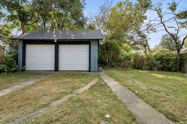 garage with a lawn