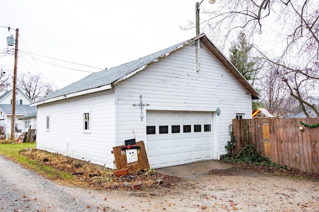 view of home's exterior with an outbuilding and a garage