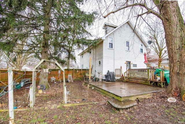 rear view of house featuring a deck