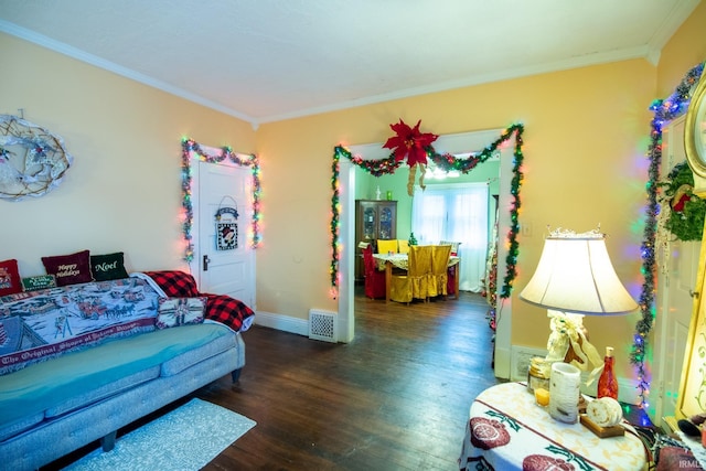 living room featuring dark hardwood / wood-style flooring and crown molding