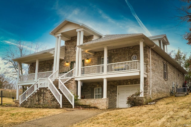 exterior space with a porch and a garage